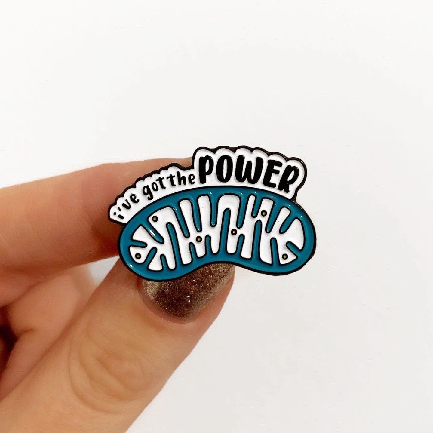 Mitochondria I've got the power blue and white enamel pin badge on white background