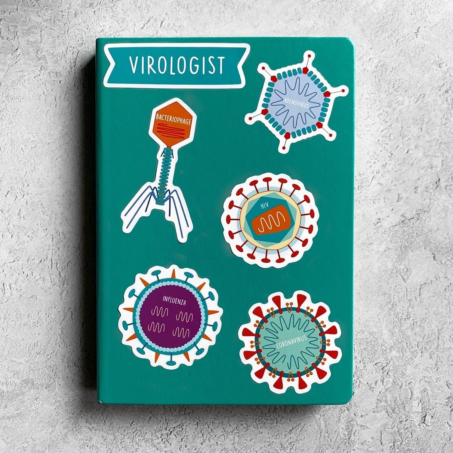 Notebook cover with illustrations of viruses and a 'Virologist' label on a textured gray background