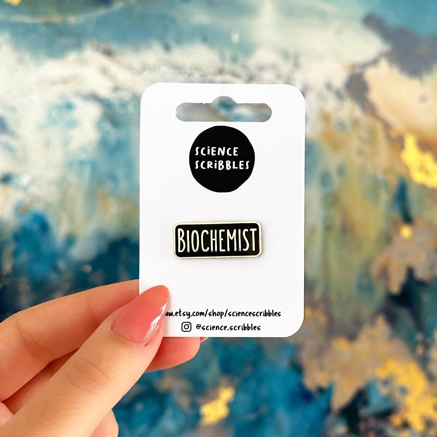 Pin with 'Biochemist' label on a blurred abstract background