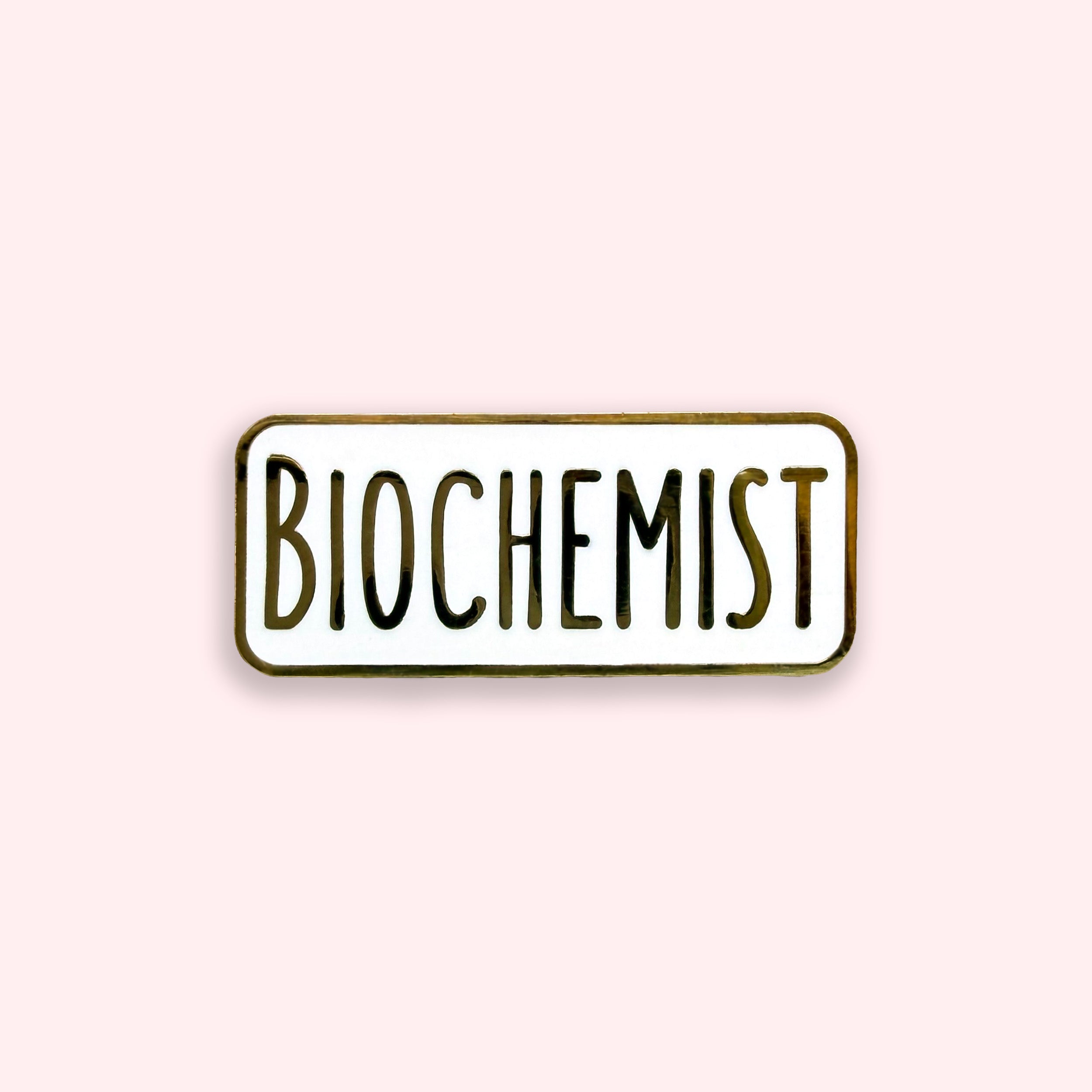 Enamel pin with 'BIOCHEMIST' text on a light pink background
