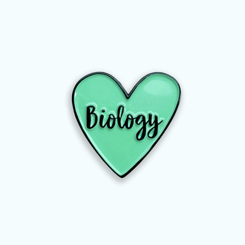 Heart-shaped pin with 'Biology' text on a blue background