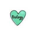 Heart-shaped pin with 'Biology' text on a white background