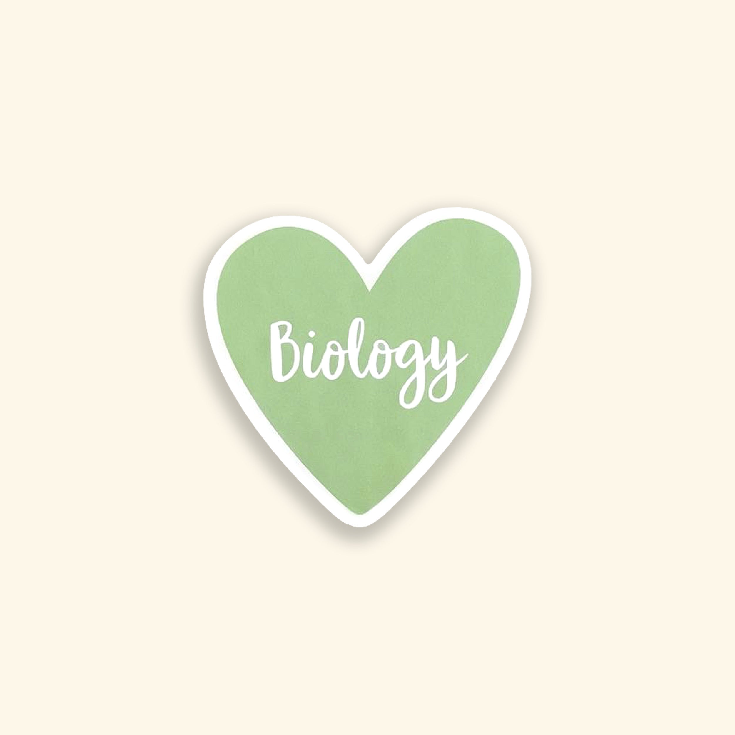Heart-shaped sticker with 'Biology' text on a beige background