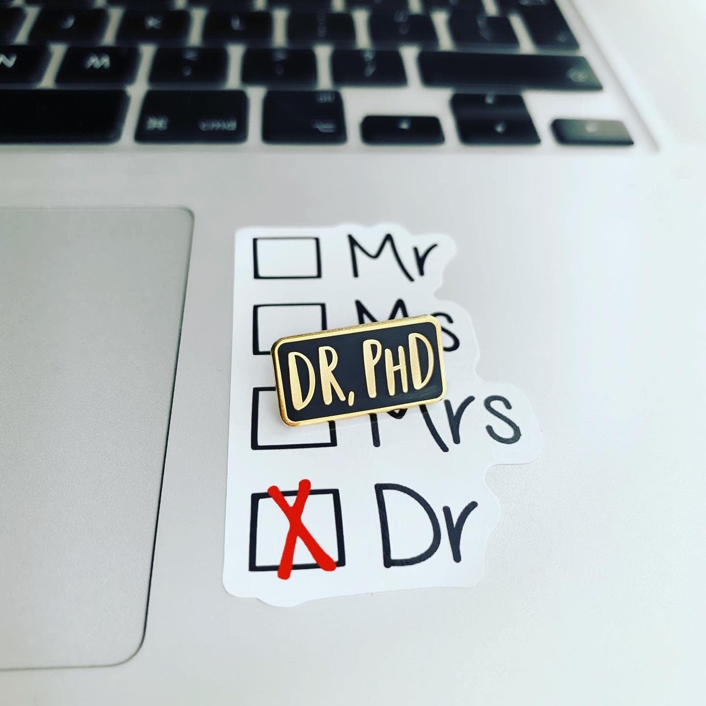Sticker on a laptop with text and checkboxes