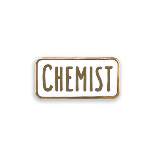 Enamel pin with 'CHEMIST' text on a white background