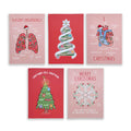 Five Christmas-themed educational cards arranged in two rows on a white background. The cards feature humorous medical illustrations such as 'Season's Breathings' on pink, a striped Christmas tree on red, an anatomical heart labeled 'I HATE Christmas' on pink, a green Christmas tree labeled 'Christmas Cell-Embryons' on red, and a white snowflake labeled 'Merry Christmas' on pink.