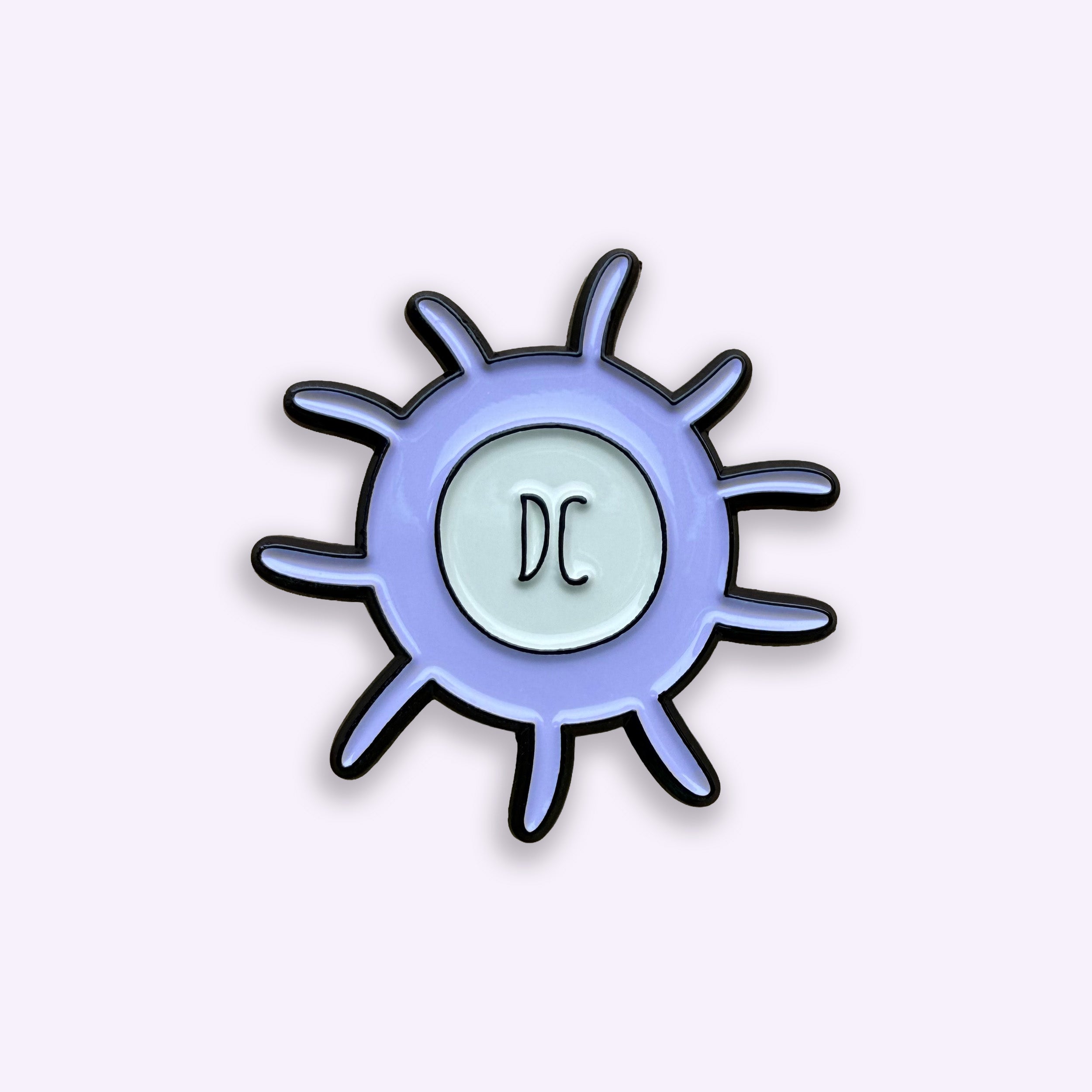 Dendritic cell purple and grey enamel pin badge on a white background
