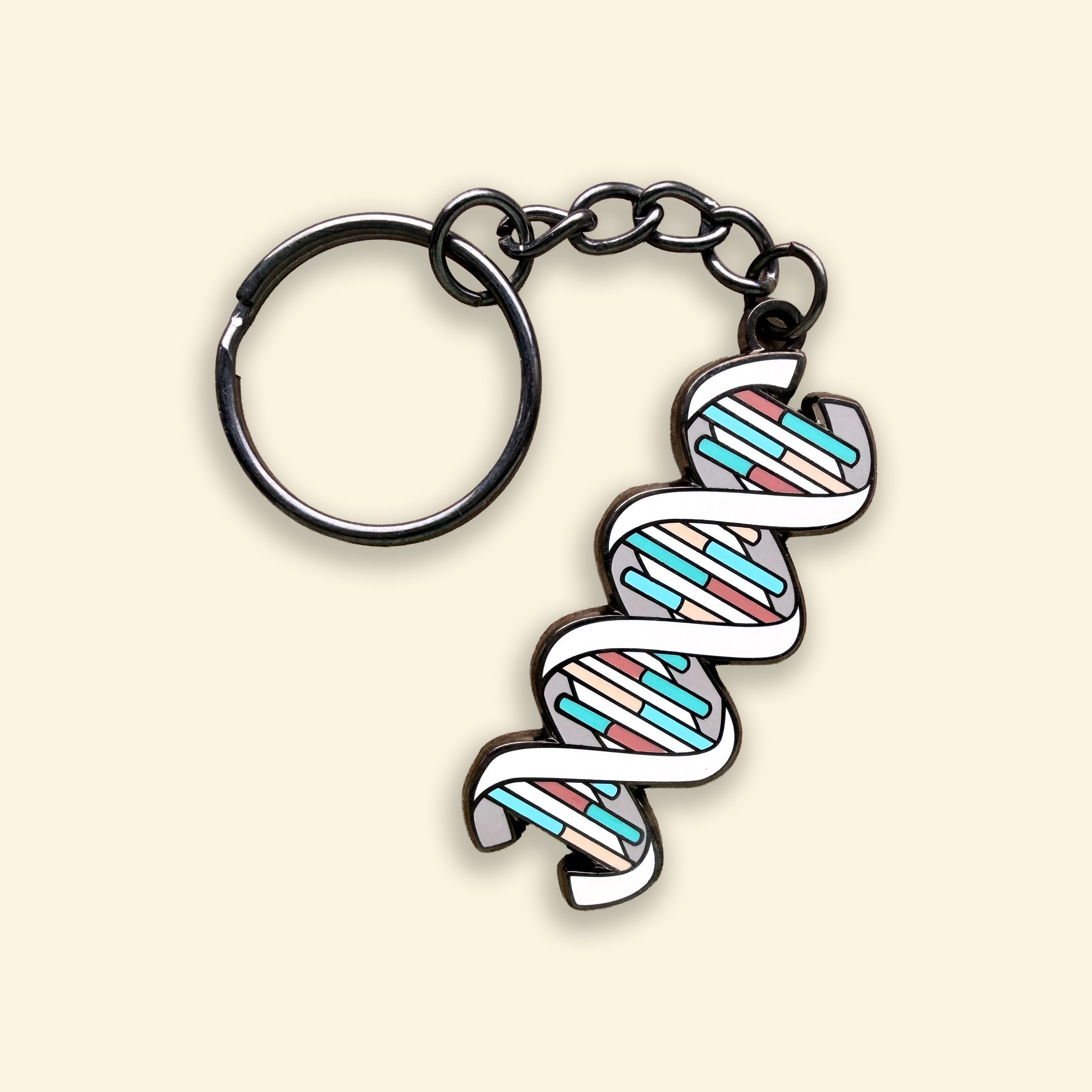 DNA colourful enamel keyring on yellow background
