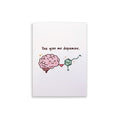 A white rectangular card or print with a cartoon brain and a dopamine molecule, plus the text 'You give me dopamine.' on a clean white background.