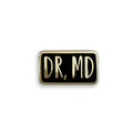 Dr MD black and gold enamel pin badge on white background