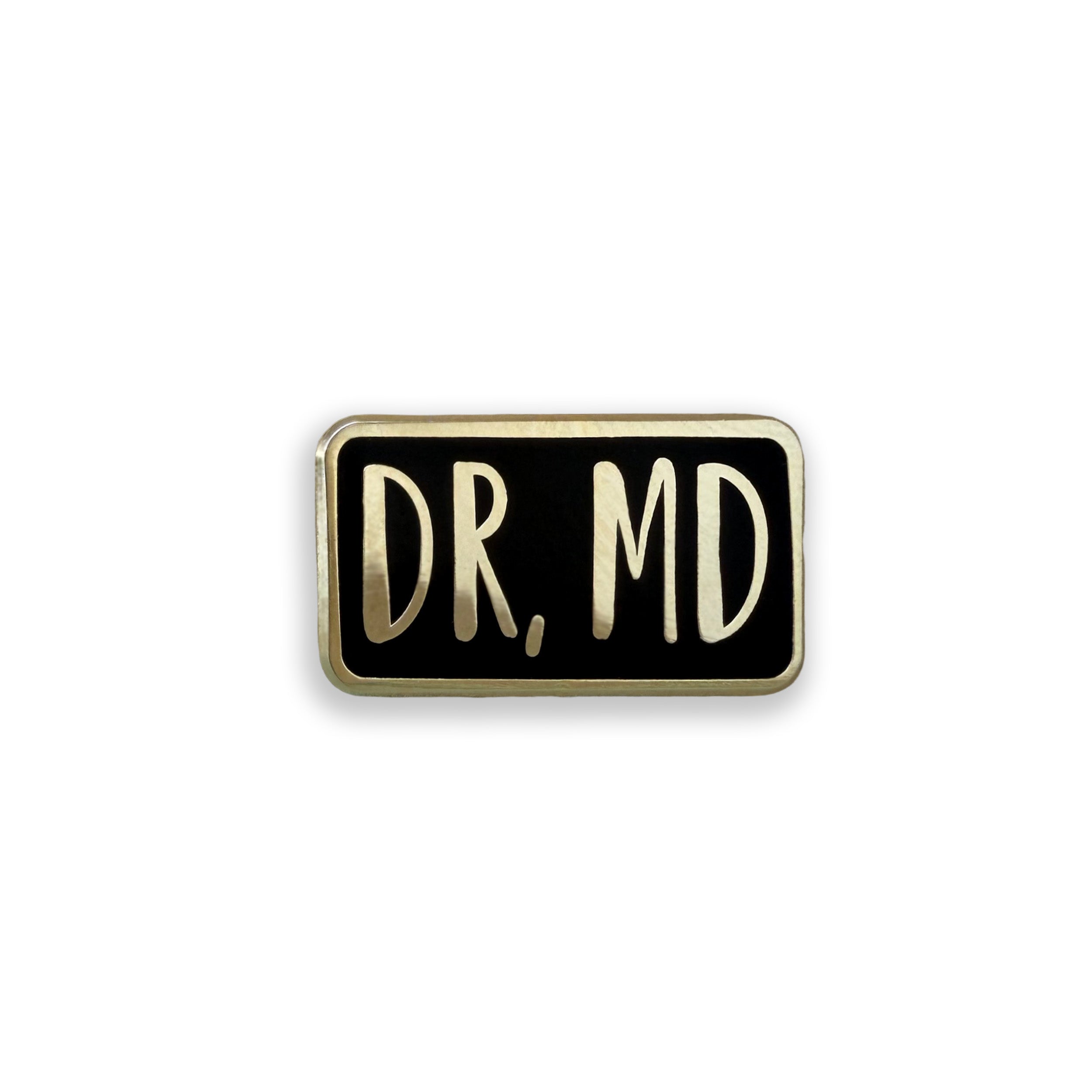 Dr MD black and gold enamel pin badge on white background