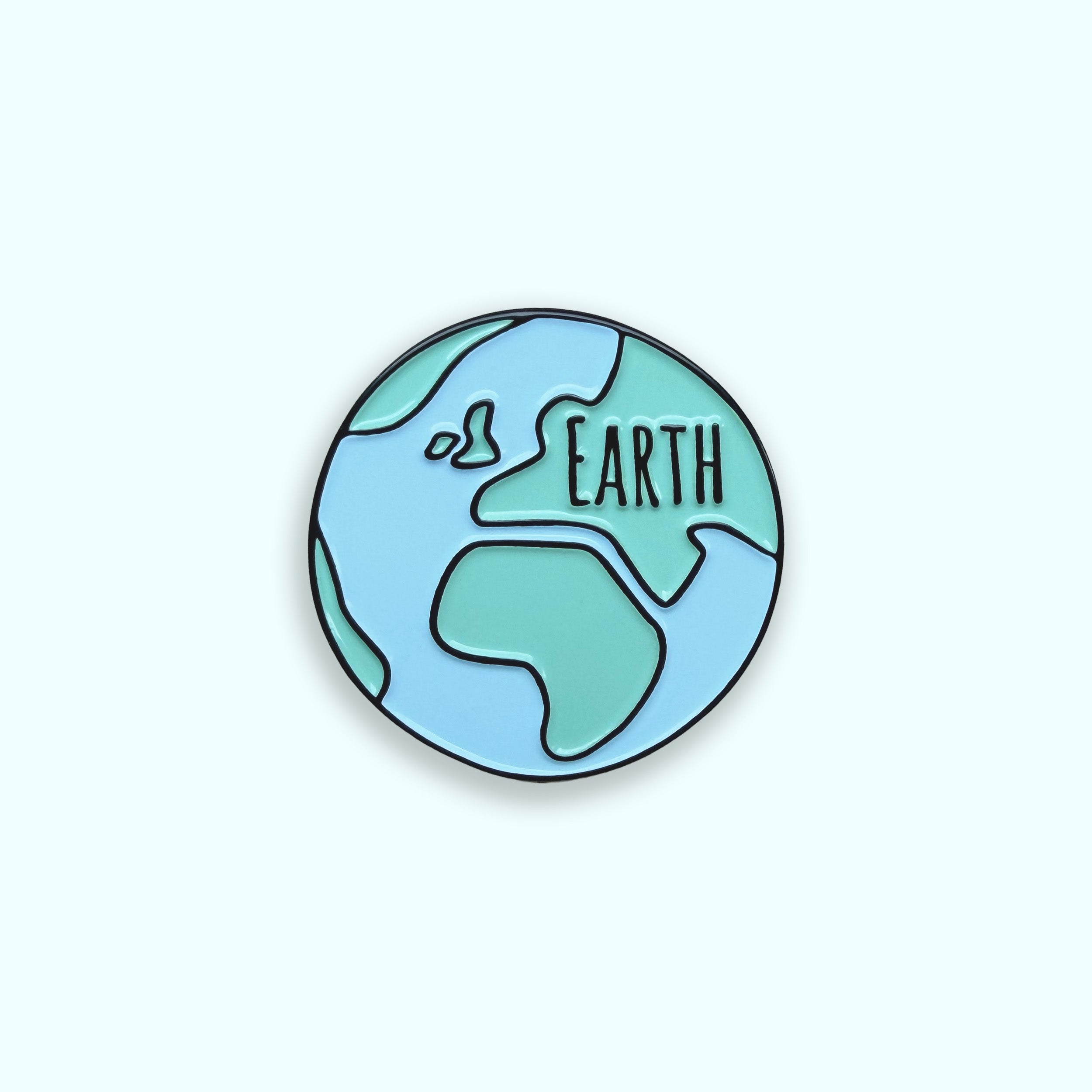Earth blue and green enamel pin badge on green background