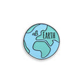 Earth blue and green enamel pin badge on white background