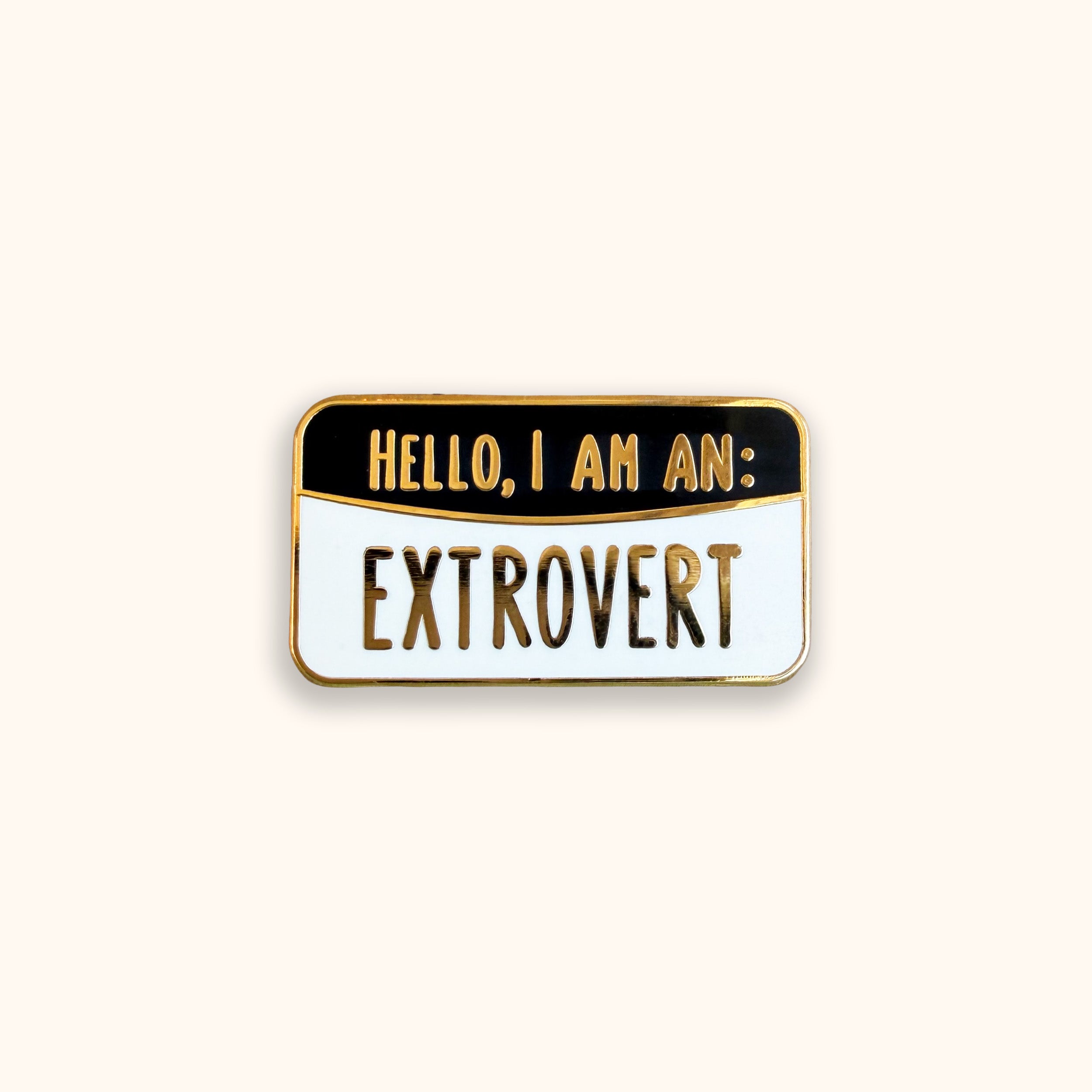 Extrovert black and white enamel pin badge on orange background