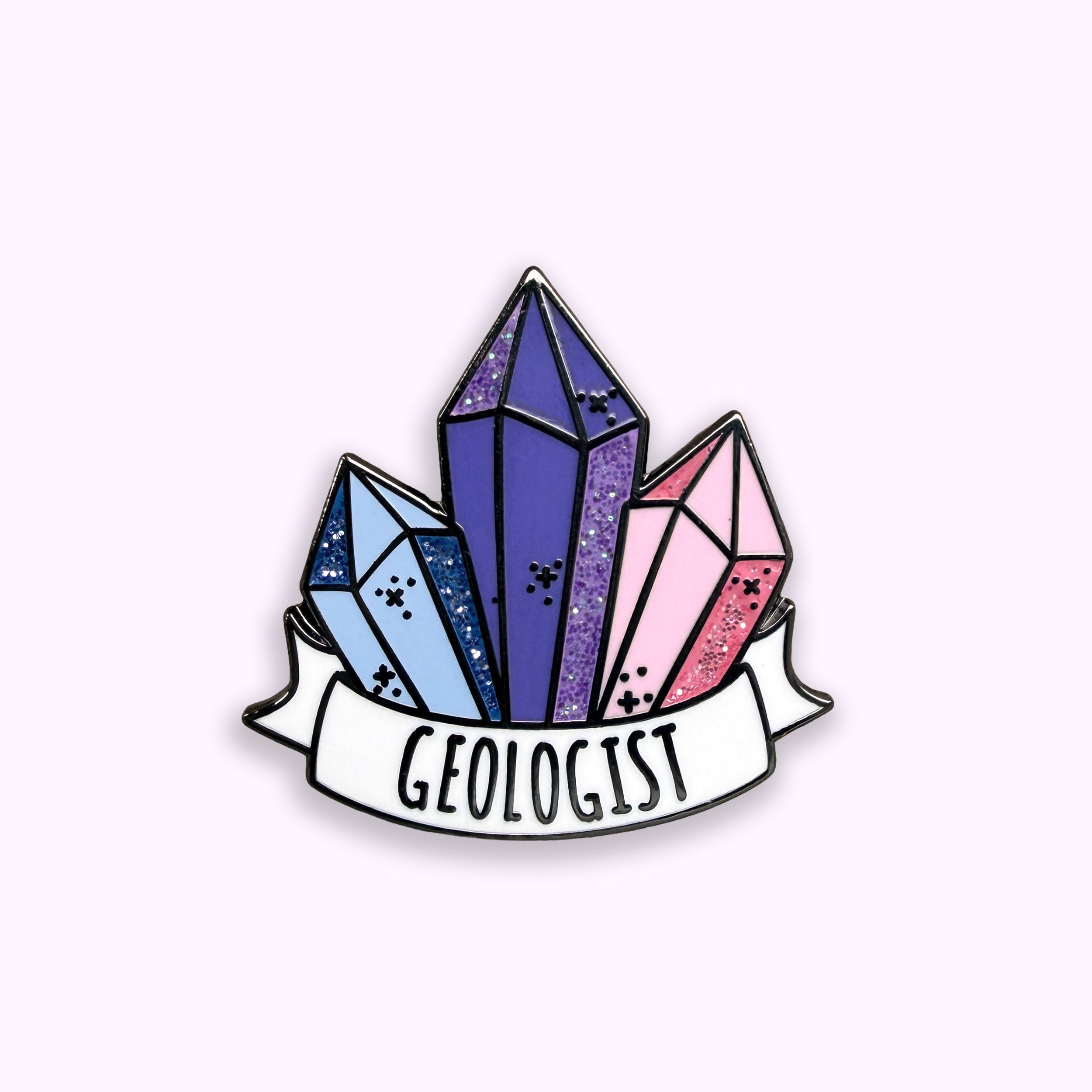 Geologist blue purple and pink glitter enamel pin badge on purple background