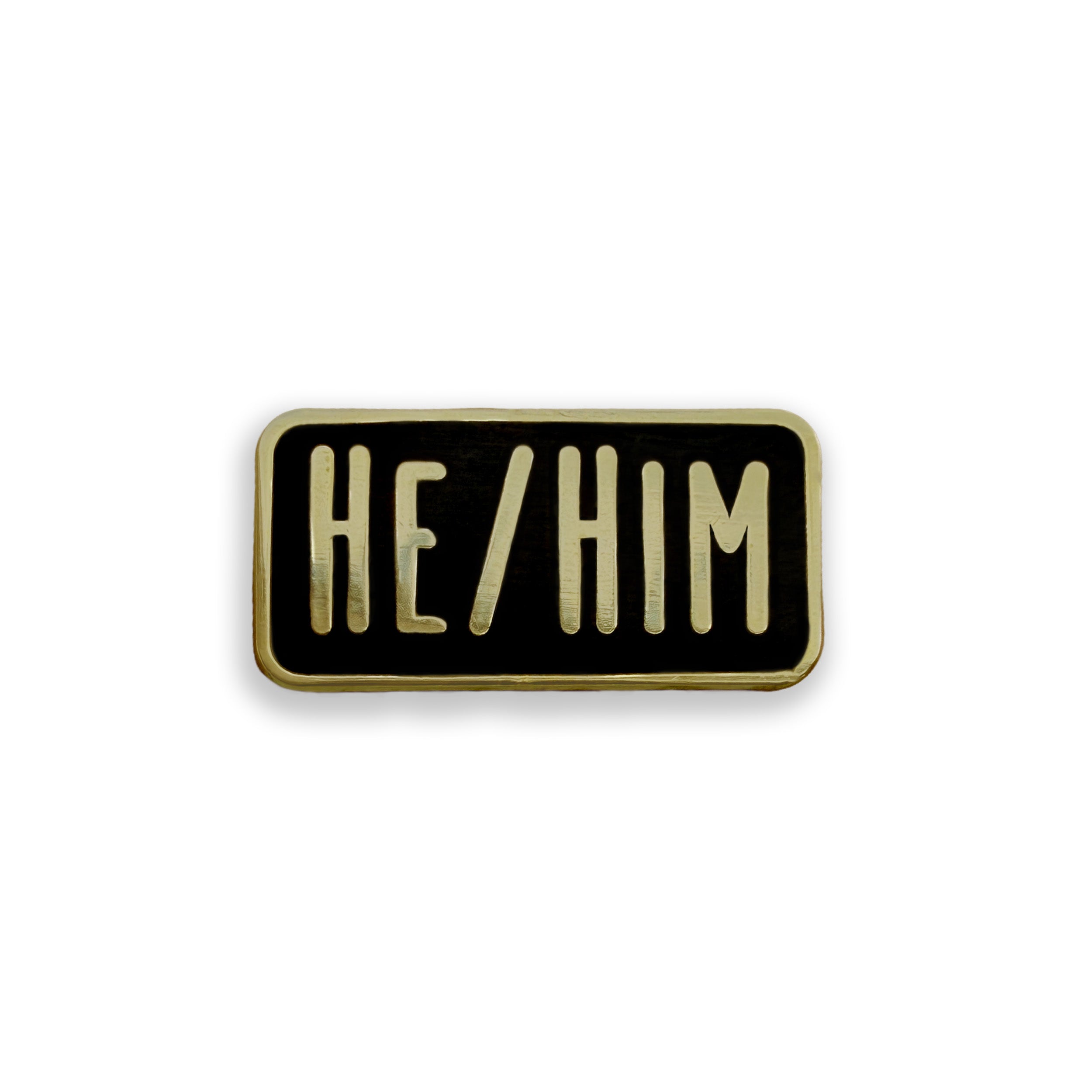 Rectangular enamel pin with 'HE/HIM' text on a black background