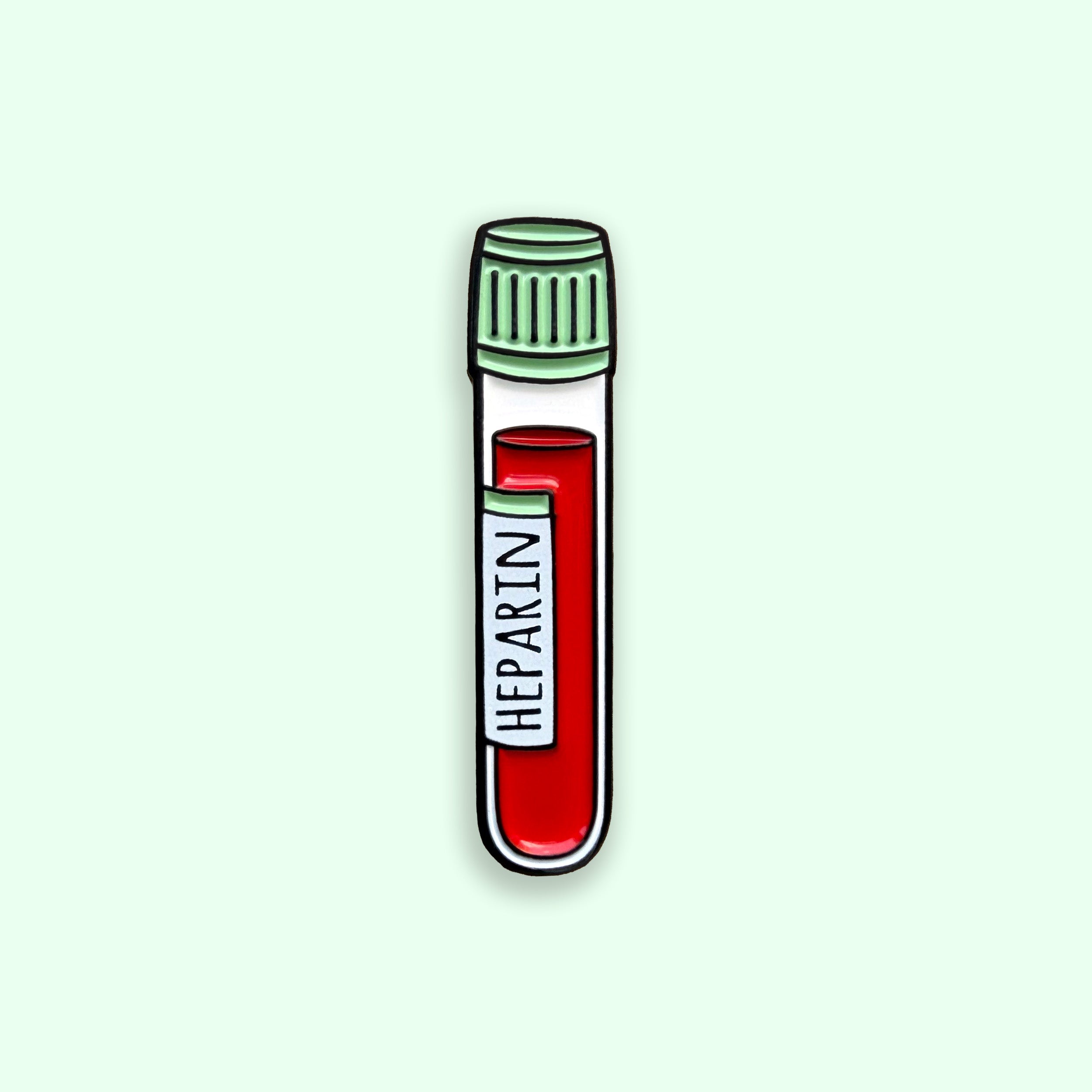 Heparin green top blood tube enamel pin badge on green background 