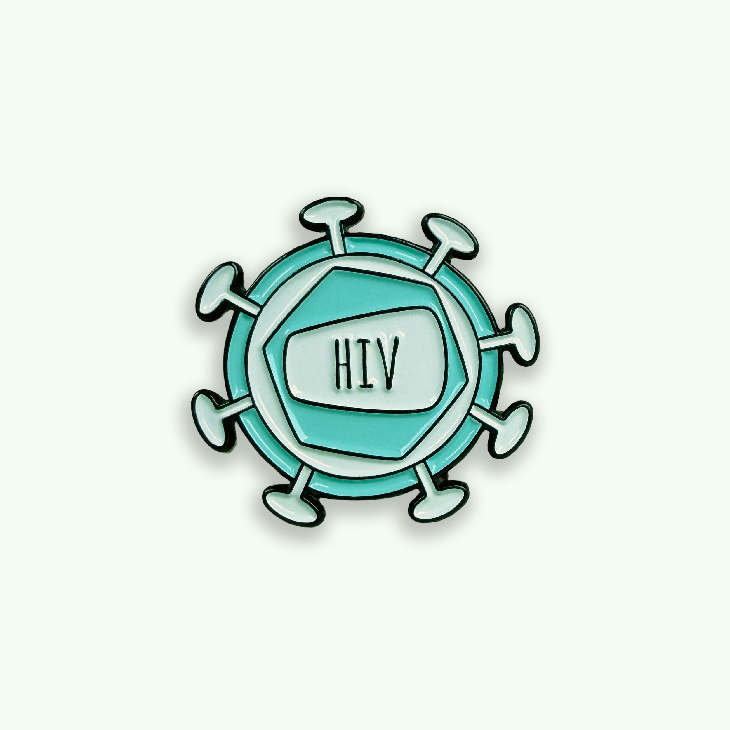 Pin with HIV virus design on a green background