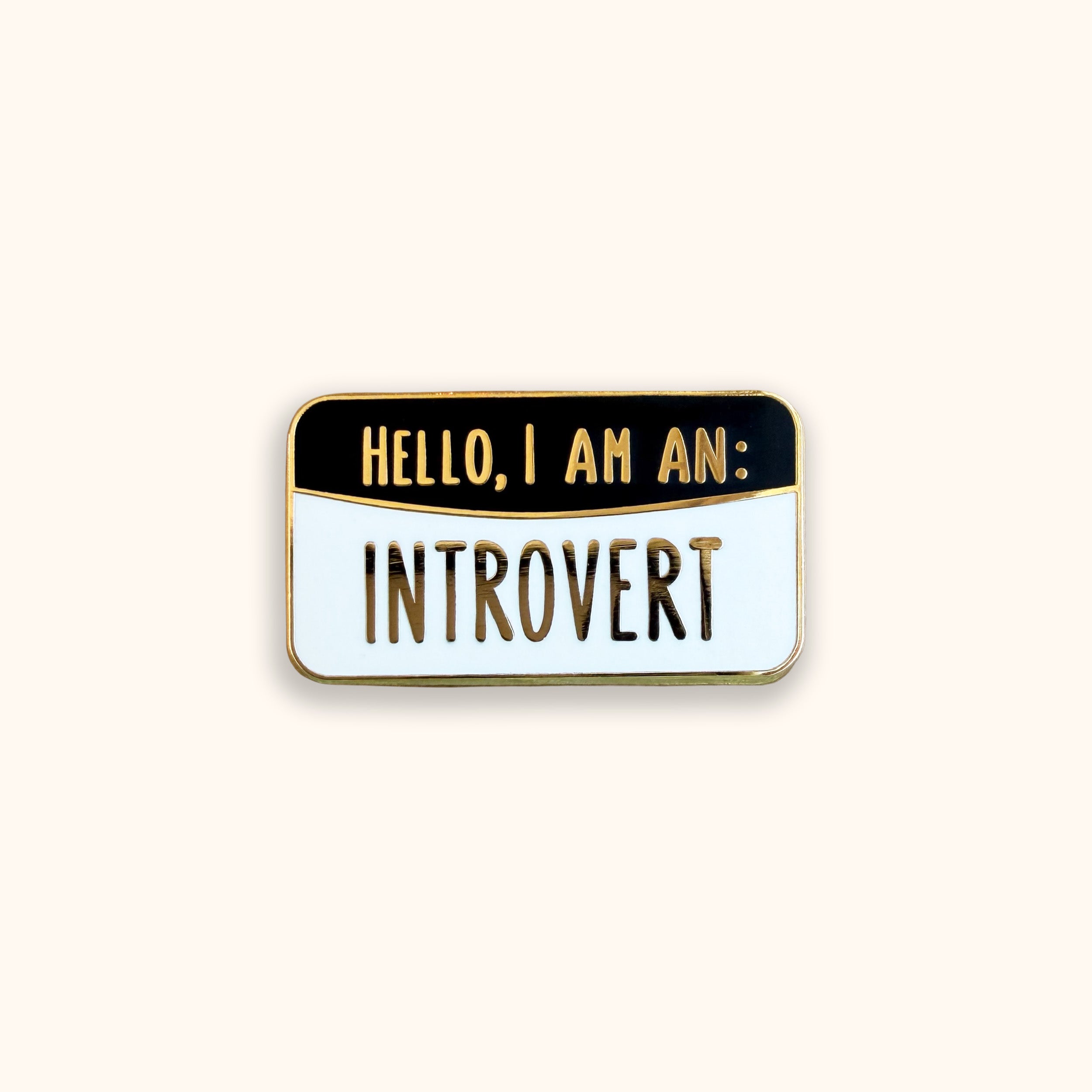 Introvert black and white enamel pin badge on orange background