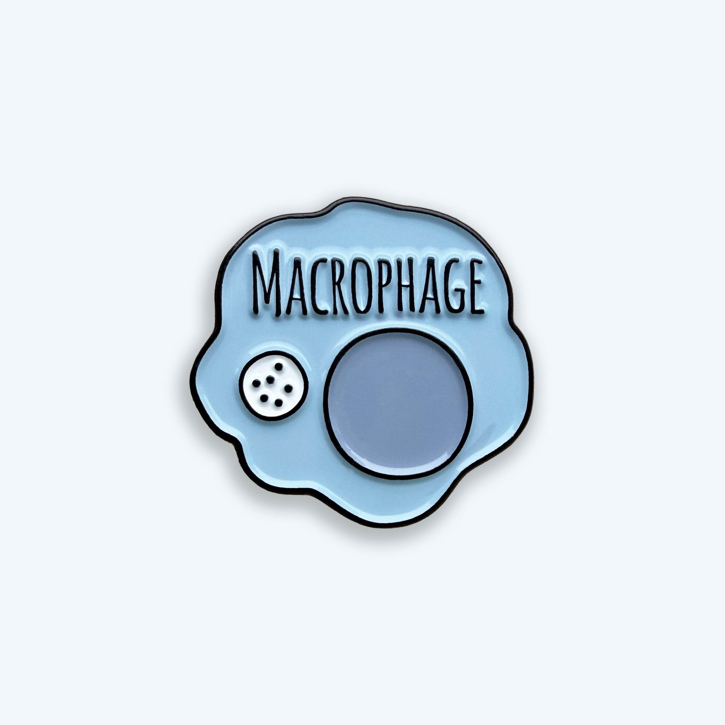 Enamel pin with 'Macrophage' text on a light blue background