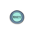 Monocyte blue and green enamel pin badge on white background
