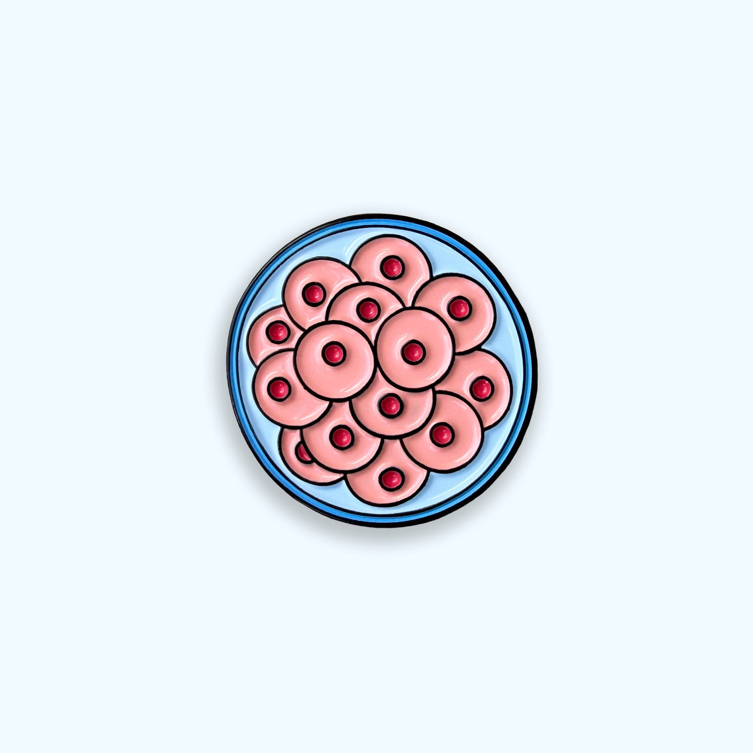 Morula pink and blue enamel pin badge on blue background