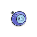 Enamel pin with 'NK Cell' text on a white background