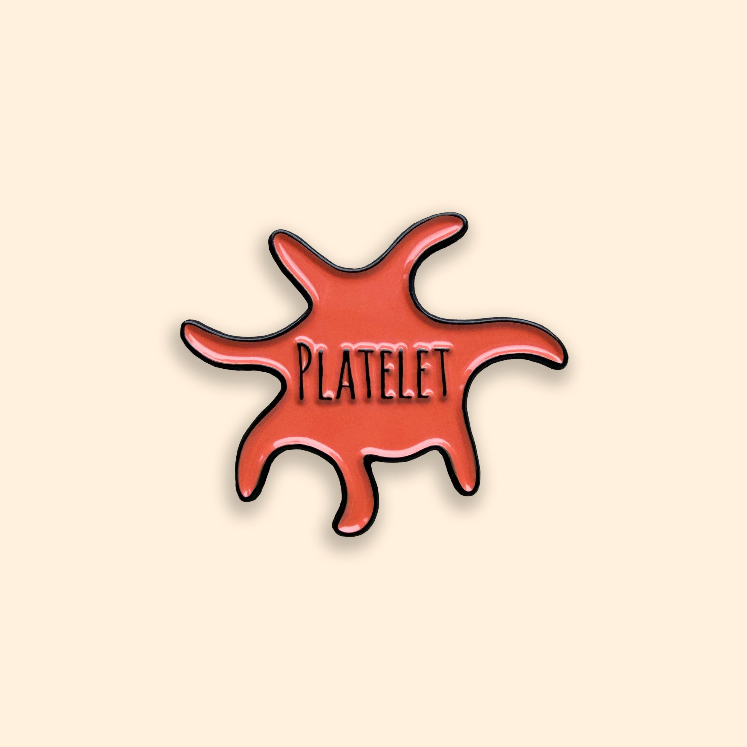 Platelet enamel pin badge on orange background