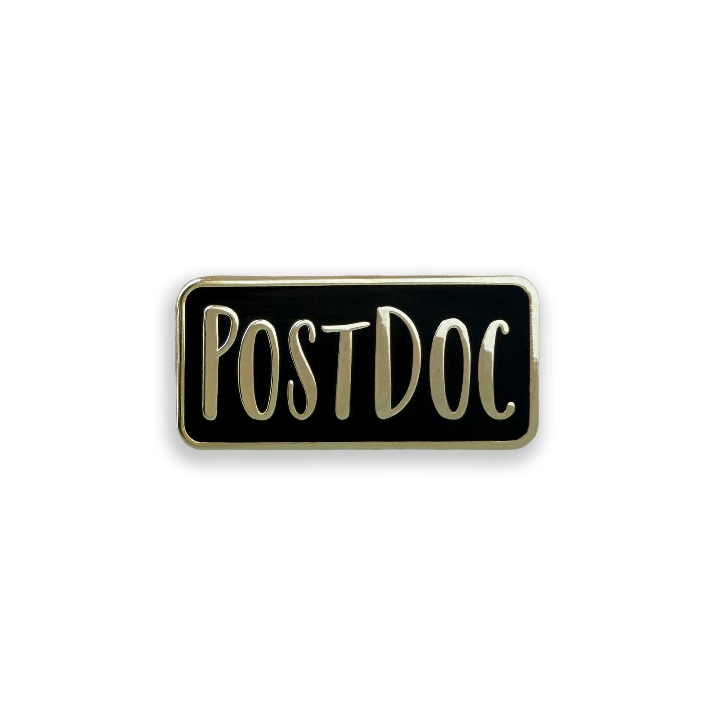 Black and gold enamel pin with the word 'POSTDOC' on it on a white background
