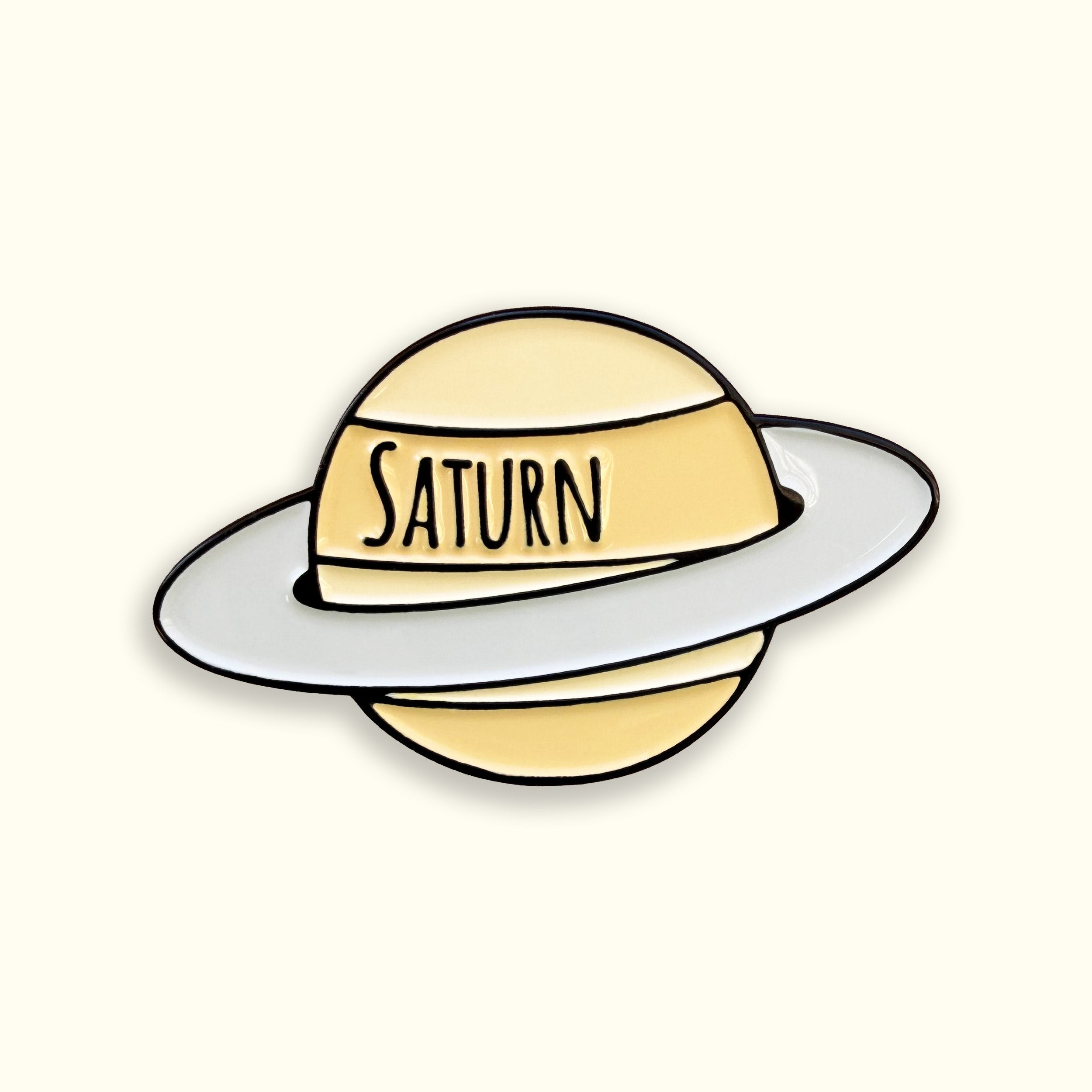 Saturn yellow enamel pin badge on yellow background