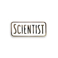 Enamel pin with 'SCIENTIST' text on a white background