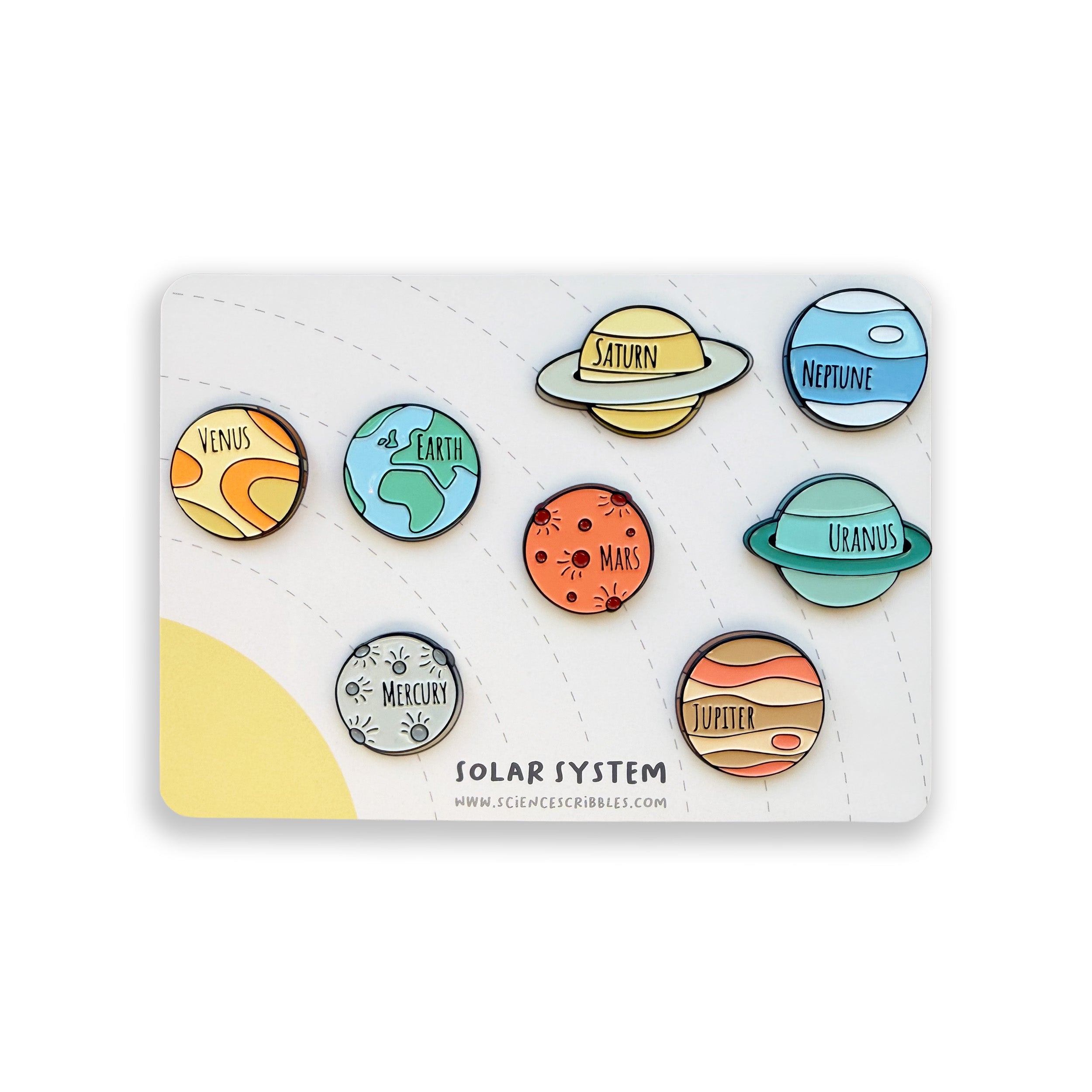 Set of colorful solar system pins on a display card.