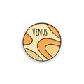 Venus orange enamel pin badge on white background