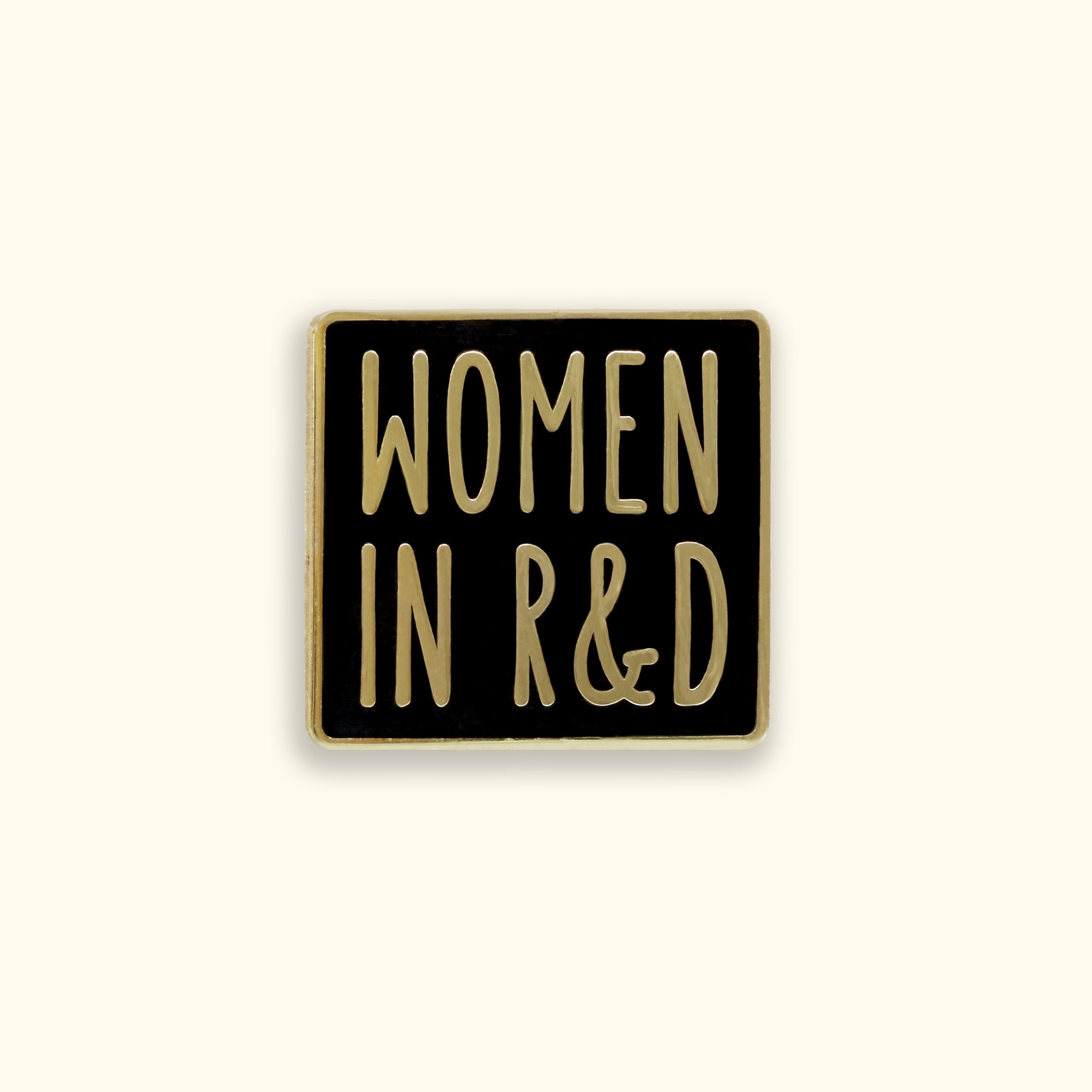 Black square pin with 'WOMEN IN R&D' text on a yellow background