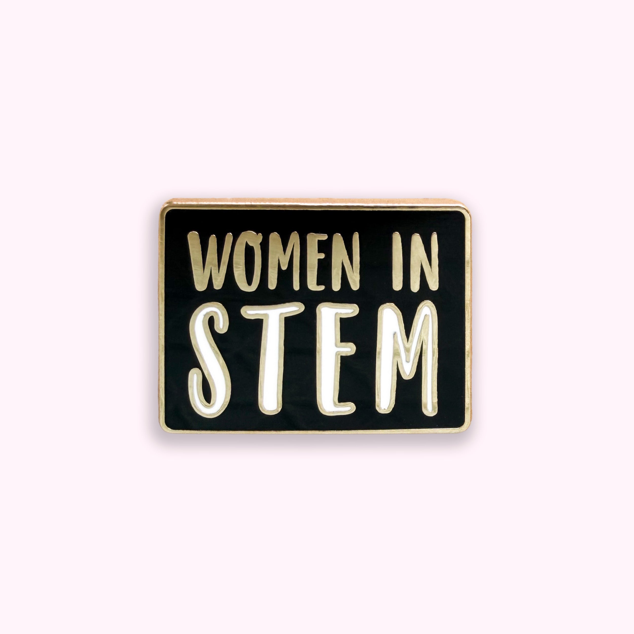 Enamel pin with 'Women in STEM' text on a black background